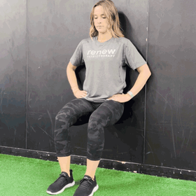 Renew physiotherapist demonstrates Wall sits