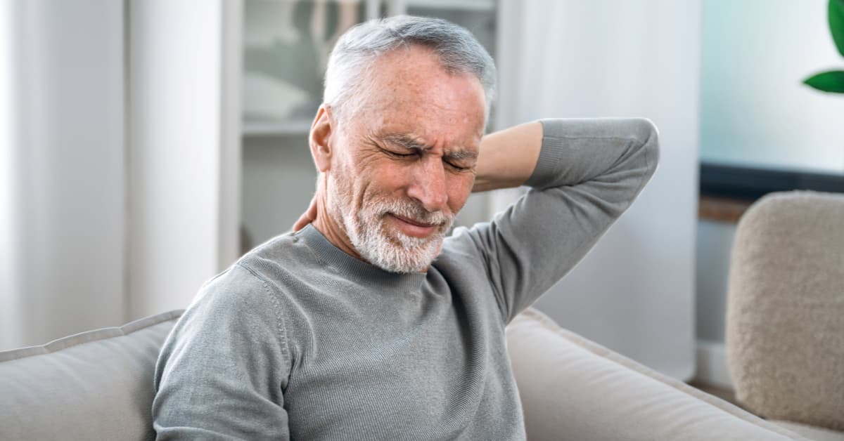 man experiencing sudden jolt of nerve pain