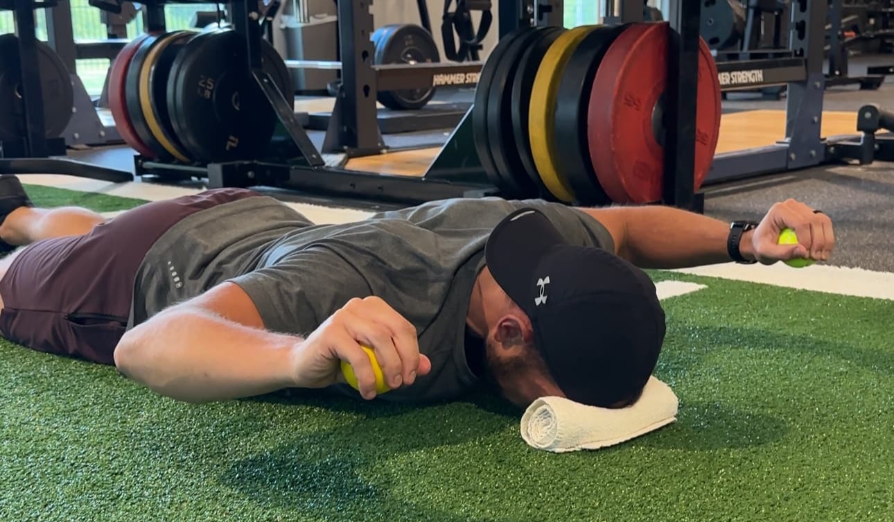 Renew Wellness Physiotherapist performing a rotator cuff strengthening exercise